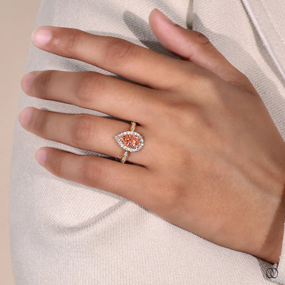 Halo engagement ring with a brilliant diamond center stone
