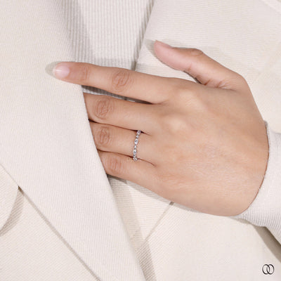 round moissanite wedding band shared prong style
