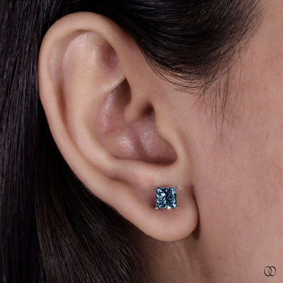 Designer earrings with refined craftsmanship and distinctive diamond settings
