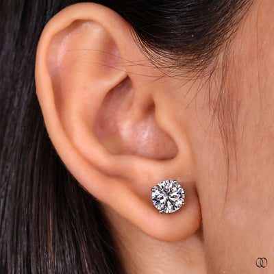 prong earrings round diamond stud style
