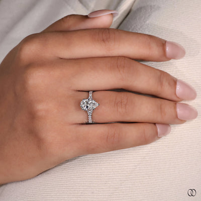 Pavé engagement ring with delicate diamond accents and a refined finish
