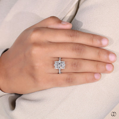 Pavé engagement ring with a brilliant diamond center stone
