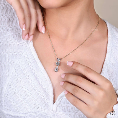 unique heart pendant with three diamond prong setting
