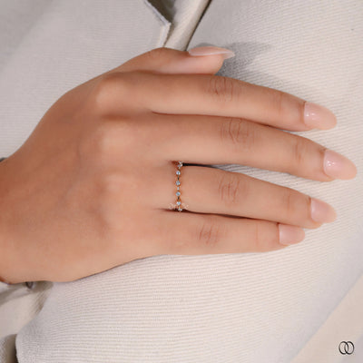 Round brilliant cut diamond band with sparkling accents
