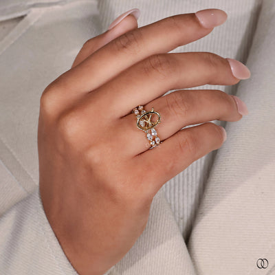 Shared prong wedding band with sparkling accent diamonds
