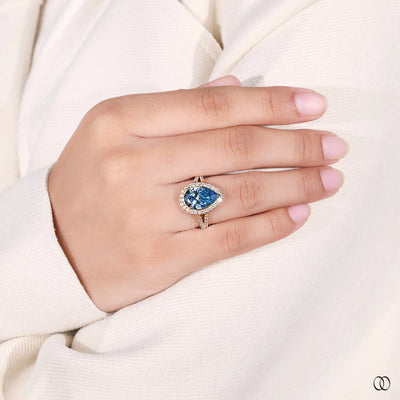 halo diamond ring blue pear diamond design
