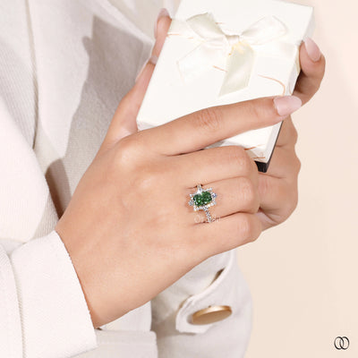 elongated cushion cut green diamond ring
