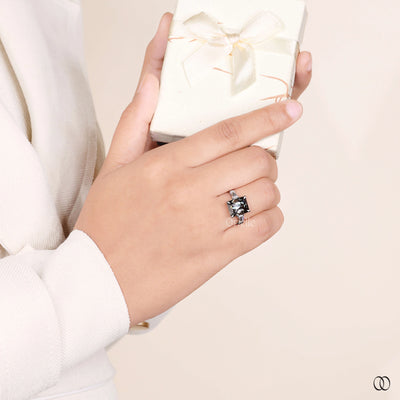 radiant cut three stone white gold ring
