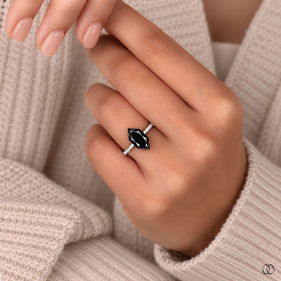 white gold engagement ring with a brilliant center stone
