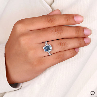 halo setting emerald cut diamond white gold
