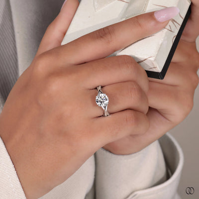 Round cut engagement ring with infinity band ring design
