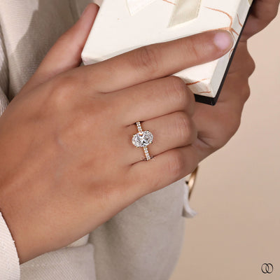 Oval engagement ring with sparkling pavé diamond accents

