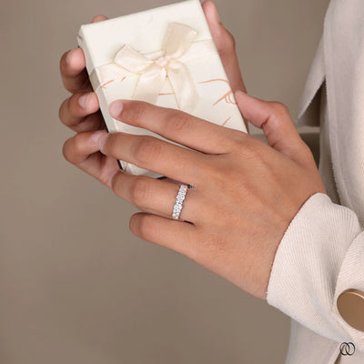 white gold round moissanite wedding band design
