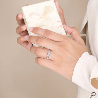 white gold round moissanite wedding band design
