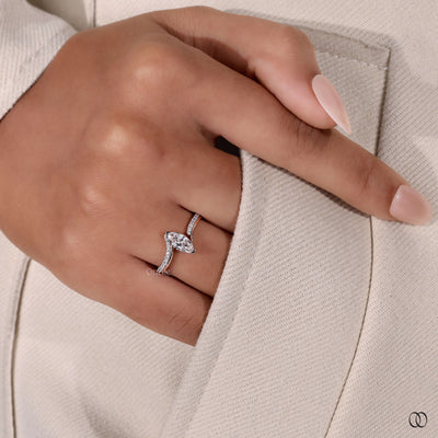 Unique design ring with a graceful shape and sparkling diamond accents
