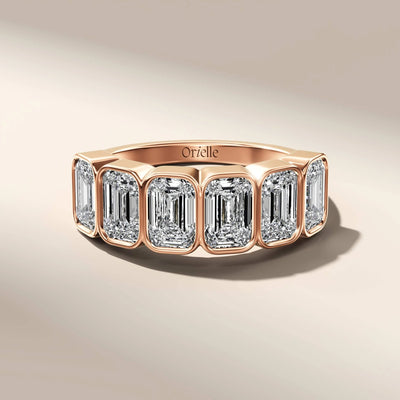 unique emerald cut half eternity band in yellow gold
