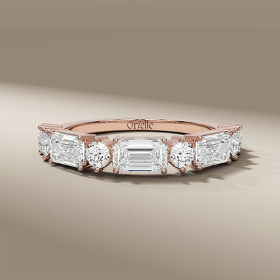 unique design emerald diamond yellow gold half eternity band
