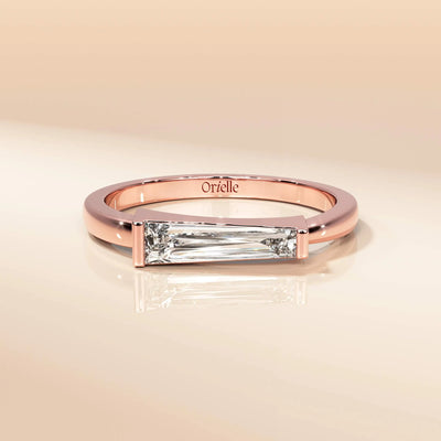 Yellow gold solitaire ring with tapered baguette accents
