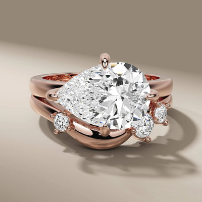 unique design bridal set featuring pear cut diamond ring
