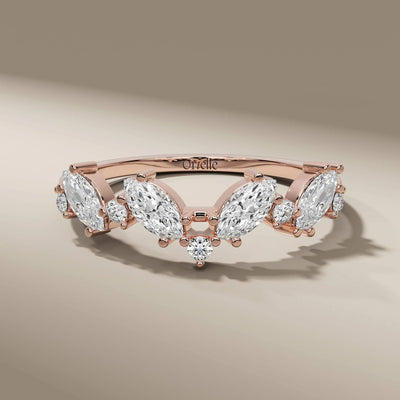 yellow gold wedding band featuring marquise diamonds
