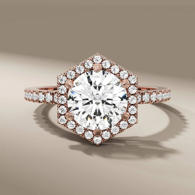 yellow gold diamond ring with hexagon halo and prong setting
