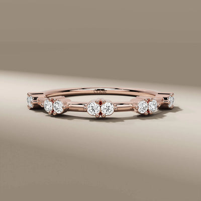 handmade band in yellow gold with round cut diamond prong setting
