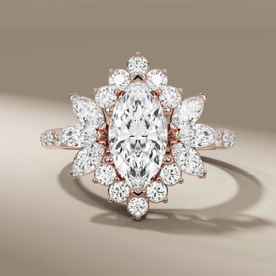 side stone ring paired with marquise cut center diamond
