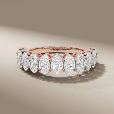 unique oval diamond wedding band in shared prong setting
