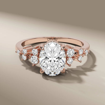prong setting ring showcasing oval diamond and side stones
