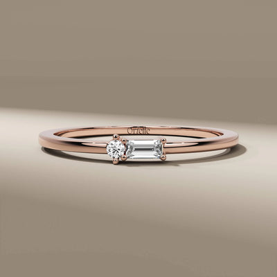 prong set band featuring round and baguette diamonds
