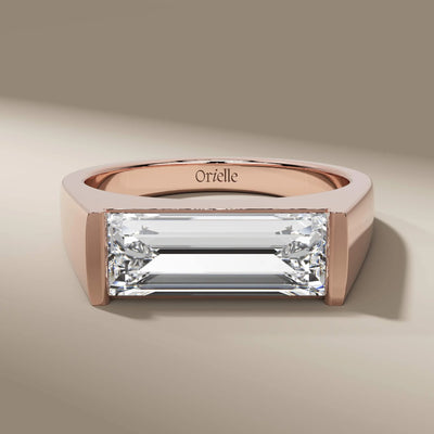 yellow gold engagement ring with baguette and solitaire diamond
