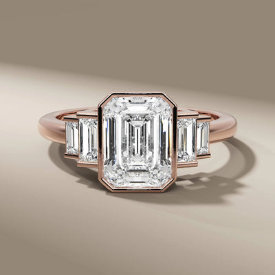 unique design ring featuring emerald cut center diamond
