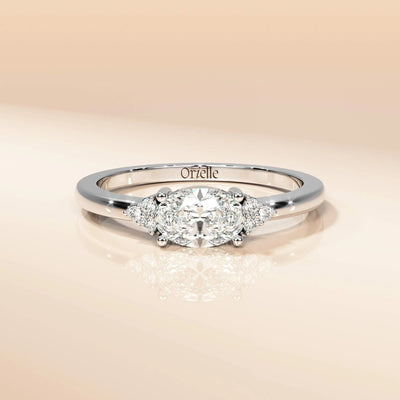 Unique oval moissanite ring with round accents
