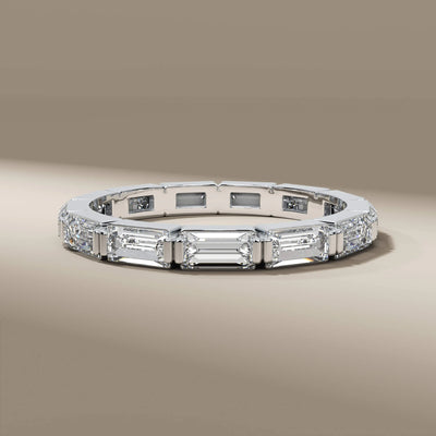 Handmade round diamond band in polished yellow gold bezel style

