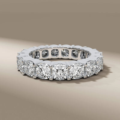 handmade yellow gold cushion shared prong eternity wedding band
