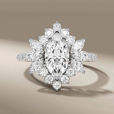 halo diamond ring in yellow gold with marquise accent
