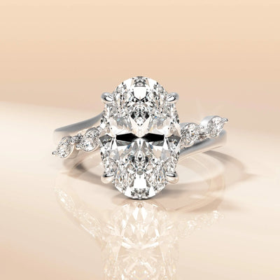 Yellow gold engagement ring with bridge accent detailing
