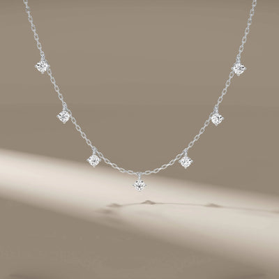 Yellow gold 7 diamond pendant on delicate chain necklace
