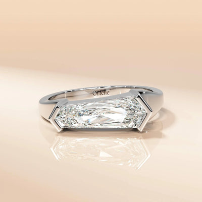Yellow gold solitaire ring with an east west layout
