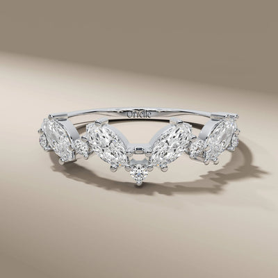 handmade band with round cut and marquise detailing
