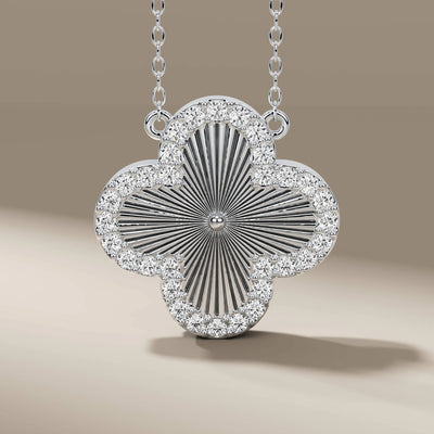 Unique design clover pendant in gold with elegant round stone

