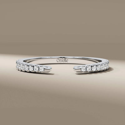 Yellow gold prong set wedding band with round cut stones
