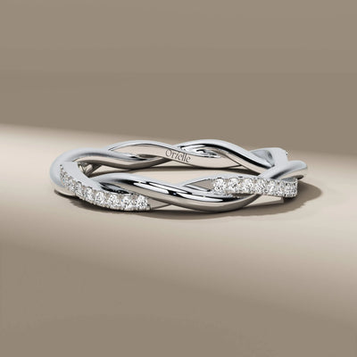 elegant twisted prong setting round diamond wedding band
