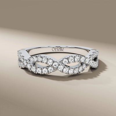 Unique design twisted band with round diamonds in prong setting

