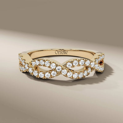 Twisted wedding band with round diamonds in white gold prong setting
