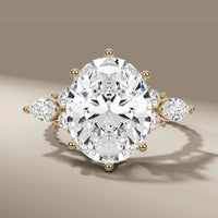 Oval Cut Diamond Ring With Side Round & Marquise