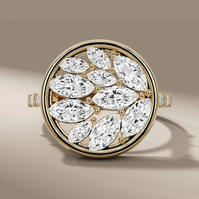 cluster engagement ring with marquise cut diamond center
