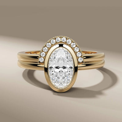 oval cut diamond ring in bezel setting for elegant bridal style
