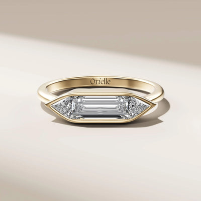 yellow gold baguette diamond ring with trilliant cut accents
