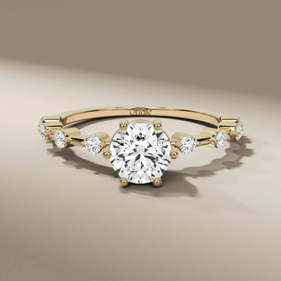 round cut diamond ring in yellow gold minimalist design
